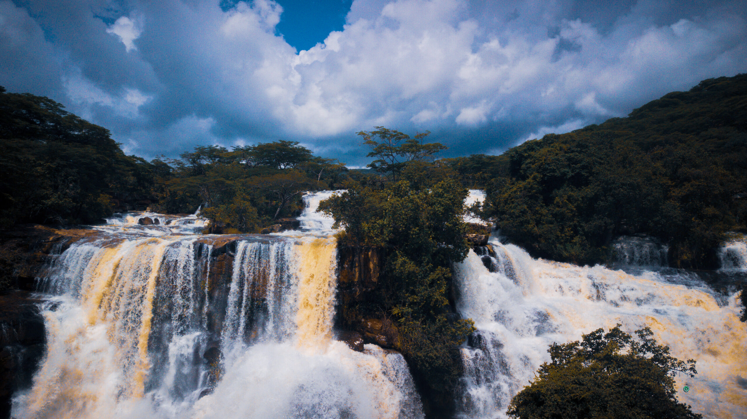 Kimani Falls tour Kimani falls is Located in Mbeya - Tanzania, one of the best attraction in Mpanga-Kipengere Game Reserve along the Kimani river. The falls is 250 meters high with many huge plunge pool at the base.